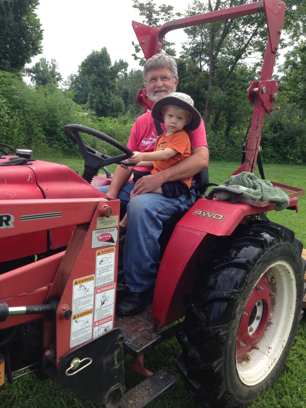 Riding the tractor with Grandpa